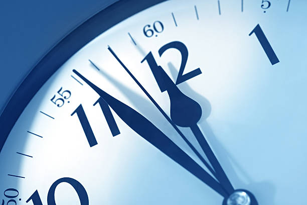 istock Close-up of analog clock counting down to midnight deadline 105491084