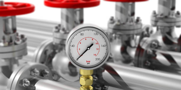 istock Industrial manometer on blur pipelines and valves background. 3d illustration 1054910890