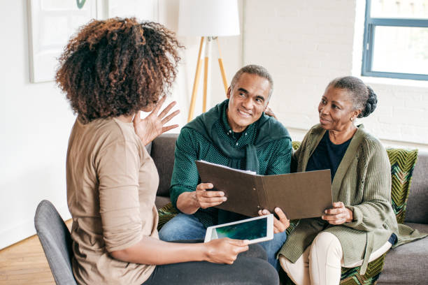 istock Home consultation for senior couple 1054911334