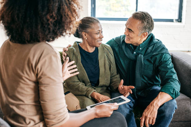 istock Home consultation for senior couple 1054911340