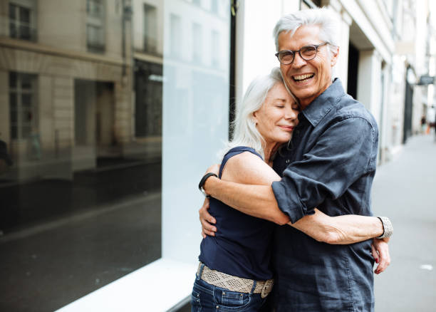 istock Senior couple walking around the city 1054912562