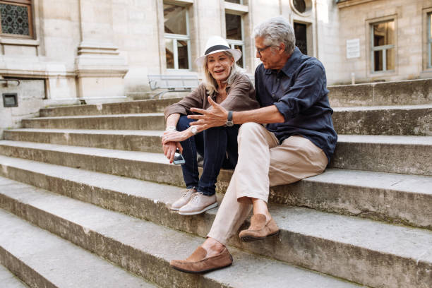 istock Senior couple walking around the city 1054912564