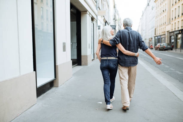 istock Senior couple walking around the city 1054912568
