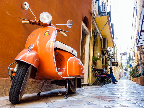 Vespa scooter on Corfu street, Greece Corfu, Greece - August 25, 2018: Vespa scooter on Corfu street Greece corfu town stock pictures, royalty-free photos & images