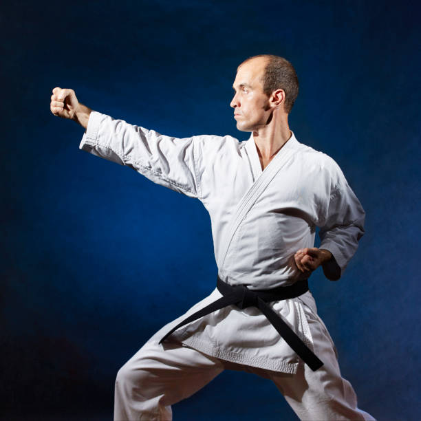 istock In a karate rack, a man coaches a formal karate exercise 1054913588