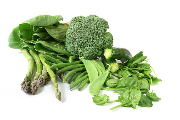 Green vegetables on white background.  Includes asparagus, zucchini or courgette,  broccoli, bok choy, beans, spinach, and snow peas.  Please see also:\n[url=http://www.istockphoto.com/my_lightbox_contents.php?lightboxID=1195650] [img]http://robynm.smugmug.com/photos/175514501-L.jpg [/img][/url]\n\n