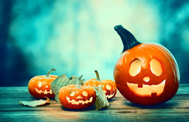 istock Halloween pumpkins at night 1054915154