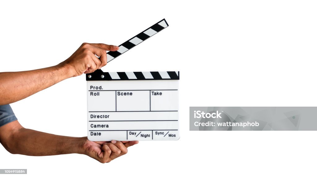 Film Clapboard Slate Hand holding a film clapboard slate or movie slate isolated on white background, with clipping path. Film Slate Stock Photo