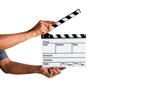 Film Clapboard Slate Hand holding a film clapboard slate or movie slate isolated on white background, with clipping path. clapboard stock pictures, royalty-free photos & images