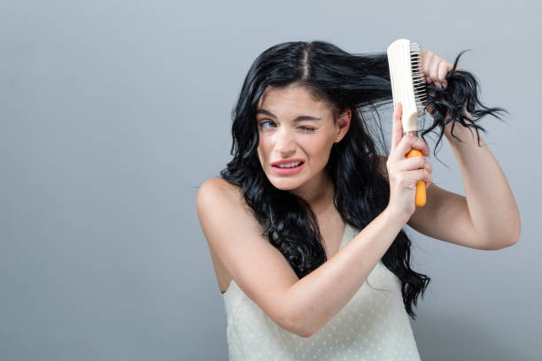 istock Damaged hair theme with young woman 1054916112