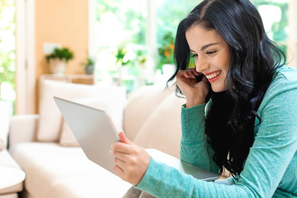 istock Young woman with a laptop computer 1054916188
