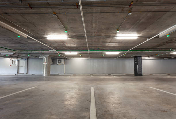 istock Parking garage interior, industrial building,Empty underground interior in apartment or in supermarket 1054916500