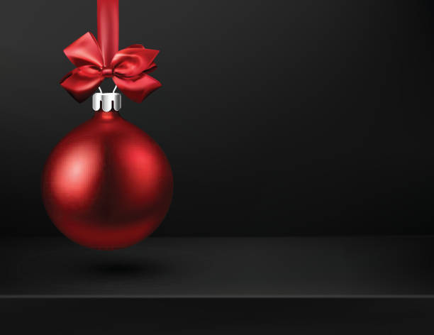 istock Black Christmas and New Year background with red 3d Christmas ball. 1054920142