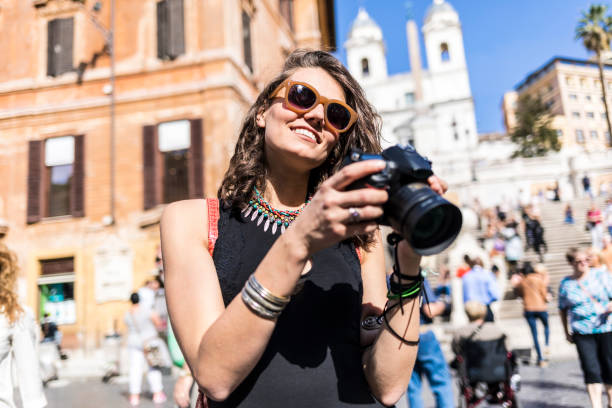 istock Beautiful woman with camera in Italy 1054922206