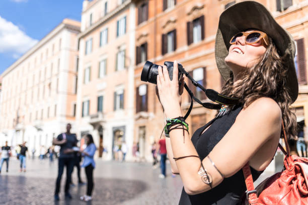 istock Beautiful woman with camera and backpack 1054922208
