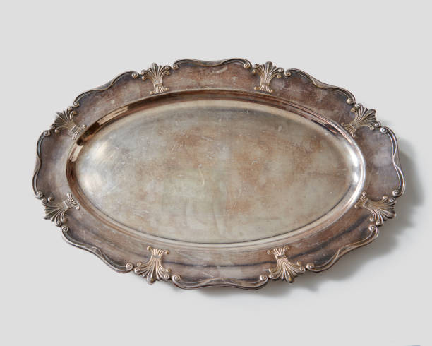 istock Vintage metal oval shaped tray with pattern on a gray background with copy space. Flat lay 1054922792