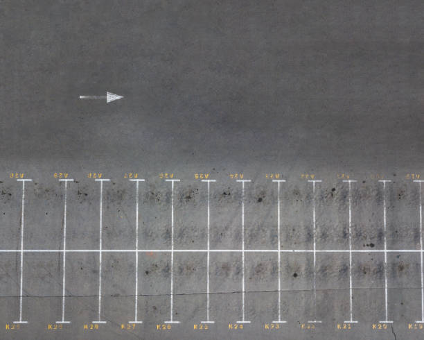 istock Panoramic view from the drone on a lot of empty parking spaces. Top view 1054922796