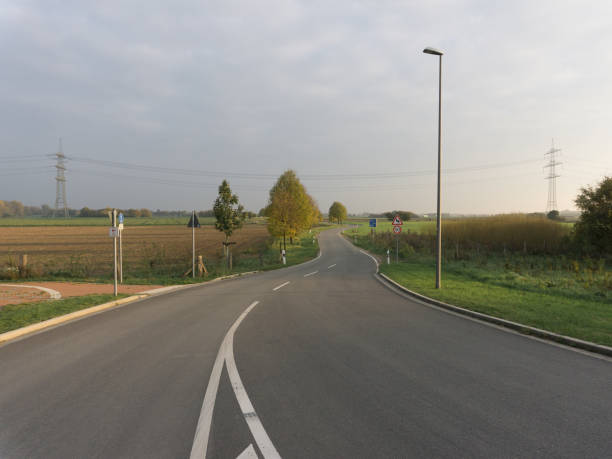 istock Road in a countryside 1054928004