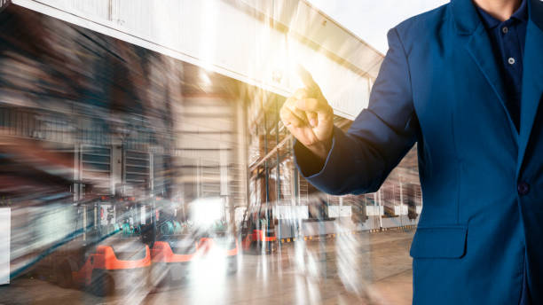istock Businessman manager touching for workers with Modern Trade warehouse logistics. 1054929982