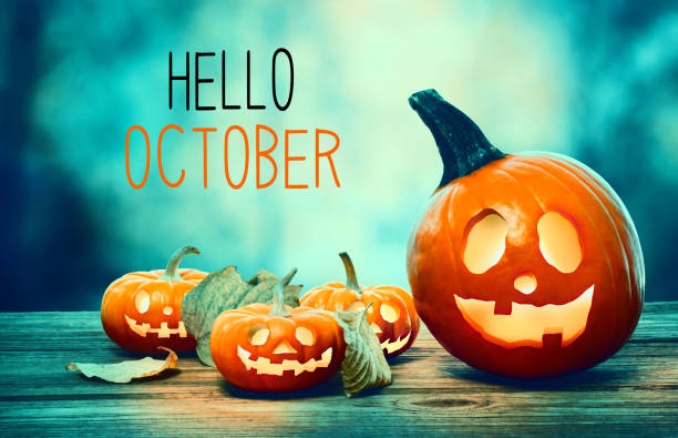 Hello October with pumpkins at night Hello October with pumpkins on a spooky forest at night october stock pictures, royalty-free photos & images