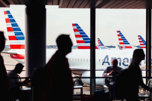 American Airlines fleet of airplanes with passengers at O'Hare Airport stock photo
