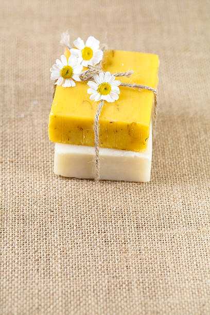 istock homemade soap bars with camomile flowers, large copy space 105493650