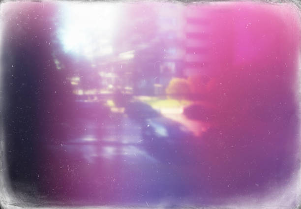 istock Vintage dusty film postcard with light leaks background 1054940474