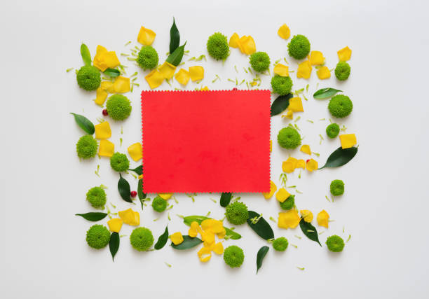 istock Red paper with wreath frame from flowers. 1054940780