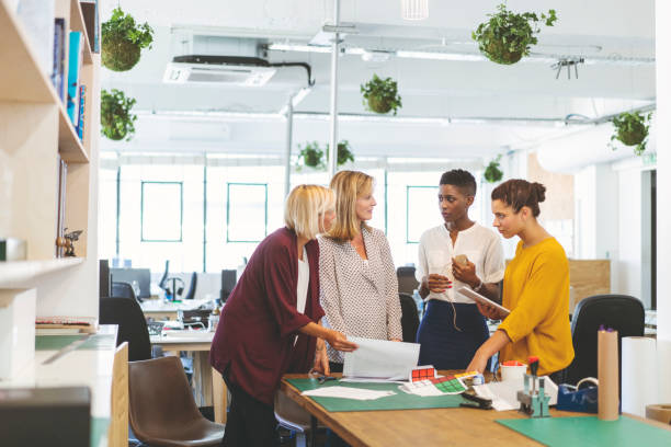 istock Multi-ethnic businesswomen discussing at office 1054944344