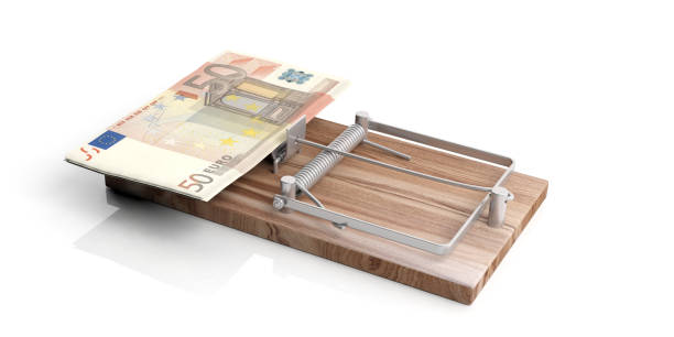 istock Euros banknotes on a mouse trap isolated on white background. 3d illustration 1054945490