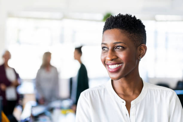 istock Female professional day dreaming at workplace 1054945500