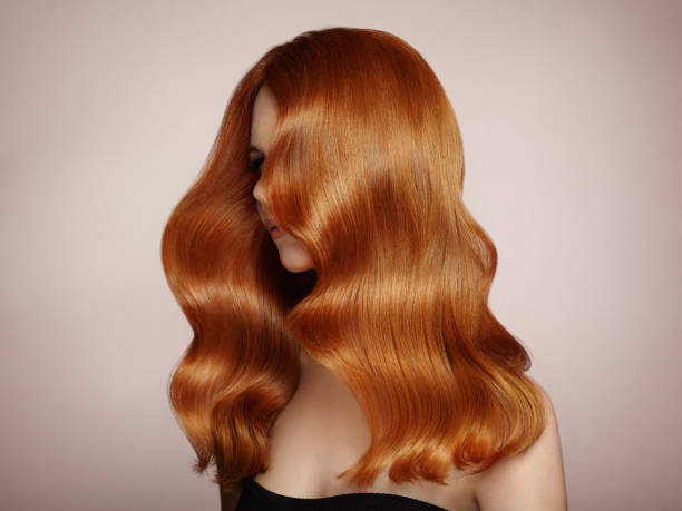 istock Redhead woman with curly hair 1054948952