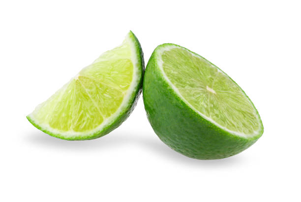 istock Half with slice of fresh green lime isolated on white background 1054949066
