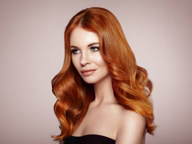 istock Redhead woman with curly hair 1054949302