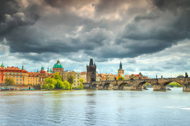 magical cloudy sky and colorful buildings in prague, czech republic - national holiday eastern europe bohemia alley imagens e fotografias de stock