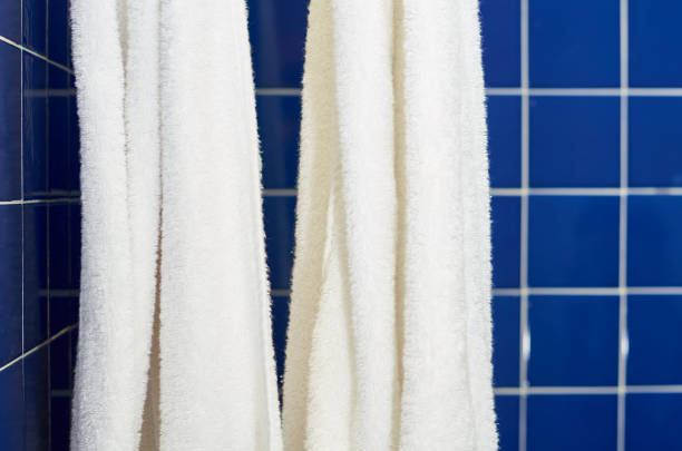 istock blue square tile in the bathroom with a white towels 1054951530