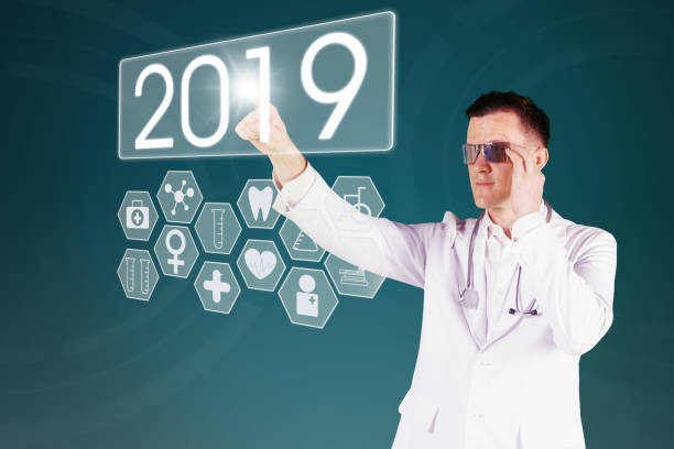 istock Caucasian male doctor pressing number 2019 1054955658