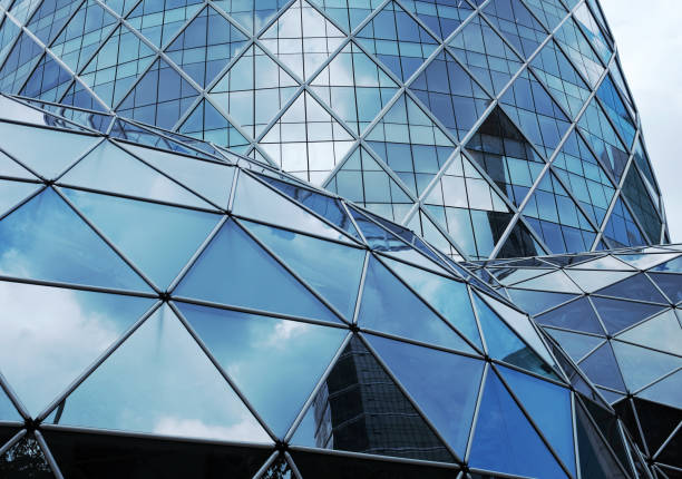 Building structures aluminum triangle geometry on facade of modern urban architecture.\