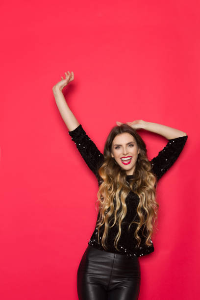 istock Happy Beautiful Woman In Black Sequin Sweater Is Cheering 1054956702
