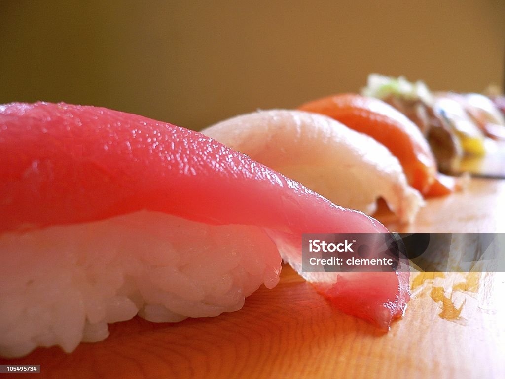 Sushi en una fila - Foto de stock de Alimento libre de derechos