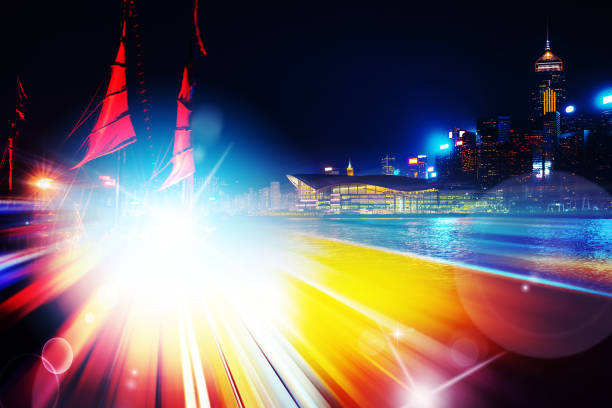 istock City night view with moving traffic light trails. double exposure 1054958778