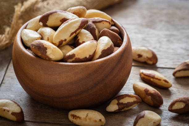 istock Brazil nuts in wooden bowl 1054961744