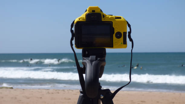 istock Camera Setup on Tripod Taking Pictures of Beach 1054962140