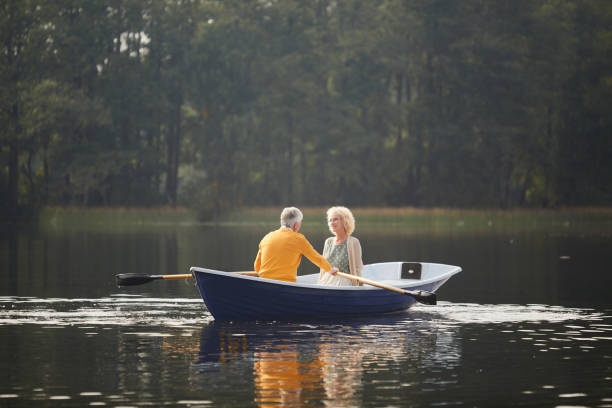 istock Senior lady talking to boyfriend on boat 1054962794