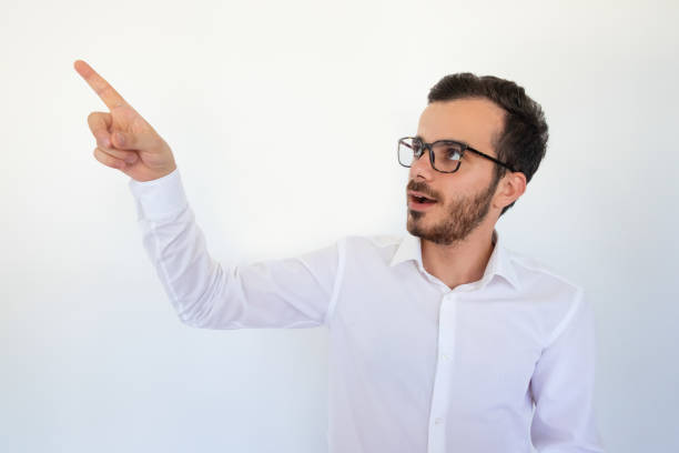 istock Surprised manager in eyeglasses making presentation and looking away 1054963004