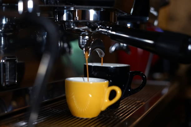 istock Barista machine pouring coffee 1054963126
