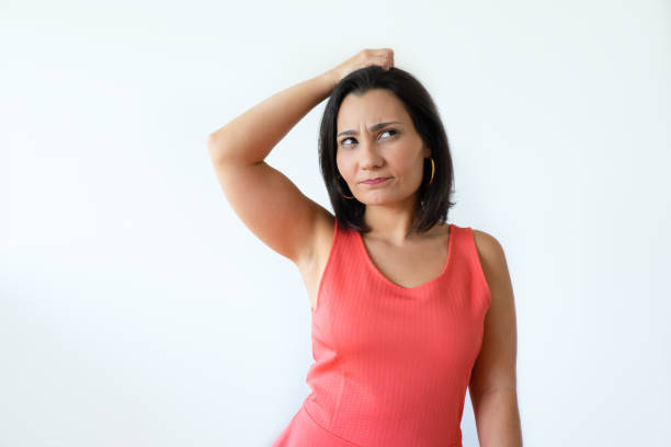 istock Attractive confused Indian girl touching head and thinking 1054963766