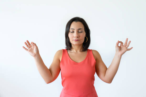 istock Calm Indian woman meditating with hands in knowledge mudra 1054963778