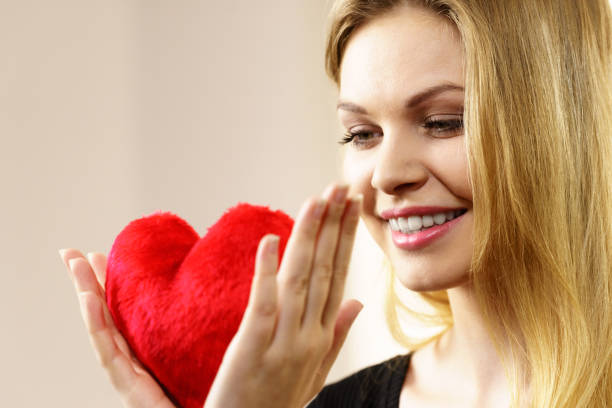 istock Woman holding red heart 1054965796