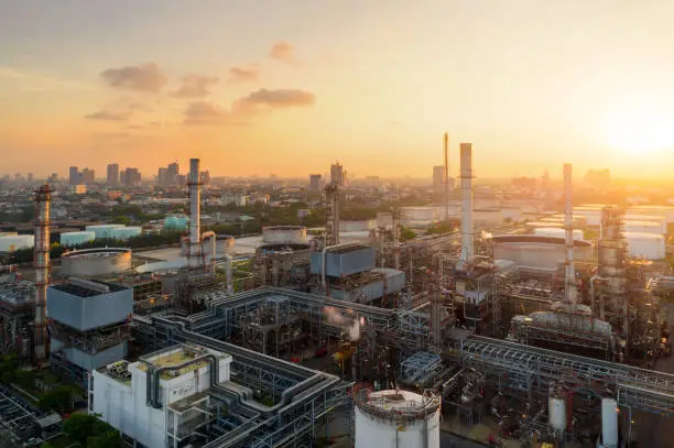 Photo of Aerial view of twilight of oil refinery ,Shot from drone of Oil refinery plant ,refinery Petrochemical plant at dusk , Bangkok, Thailand